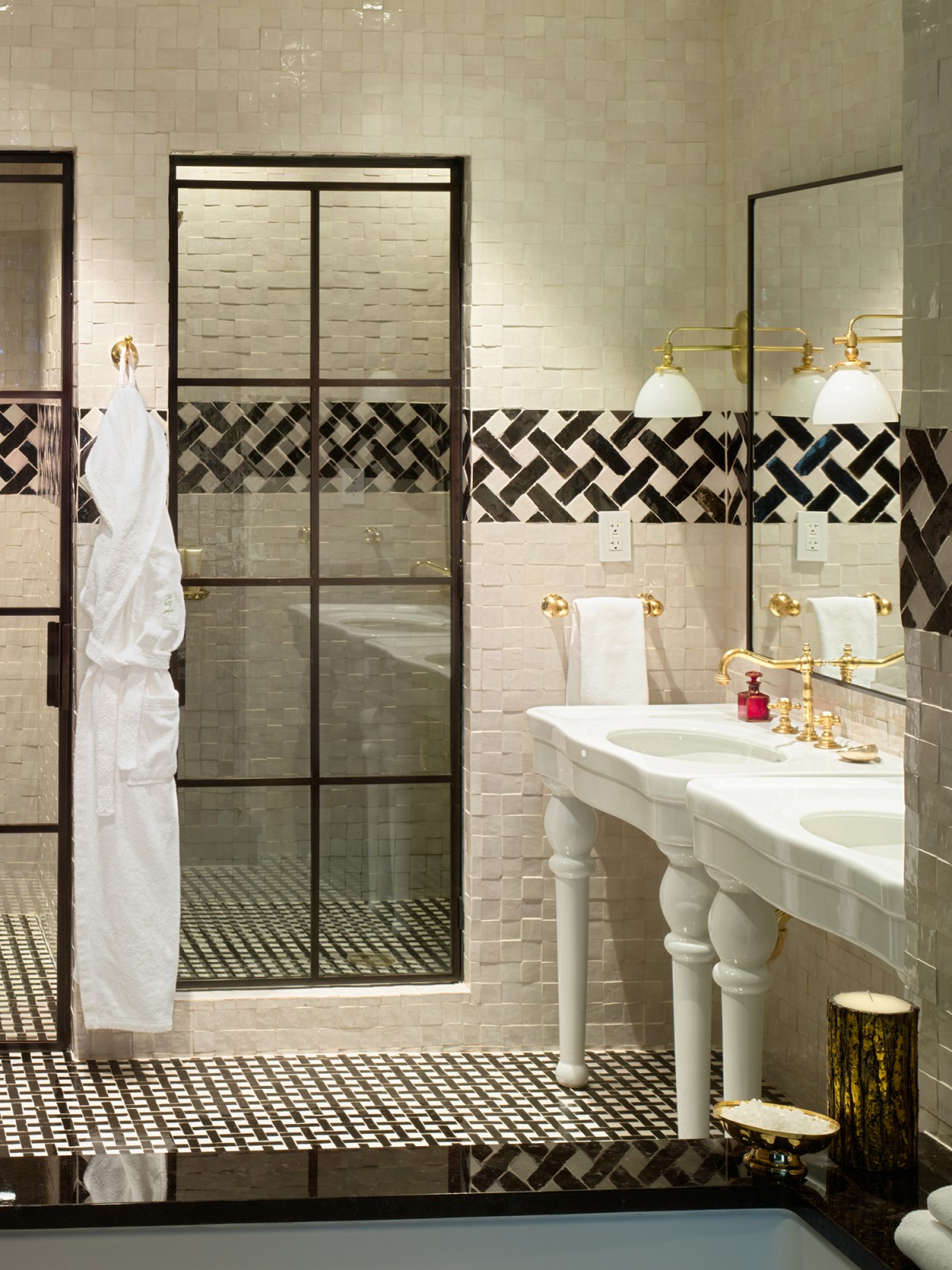 Detail of double sinks and showers in the N. Moore Penthouse at the Greenwich Hotel