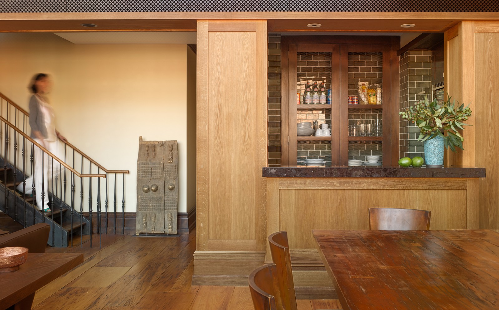 View of the stairs and kitchen in the N. Moore Penthouse