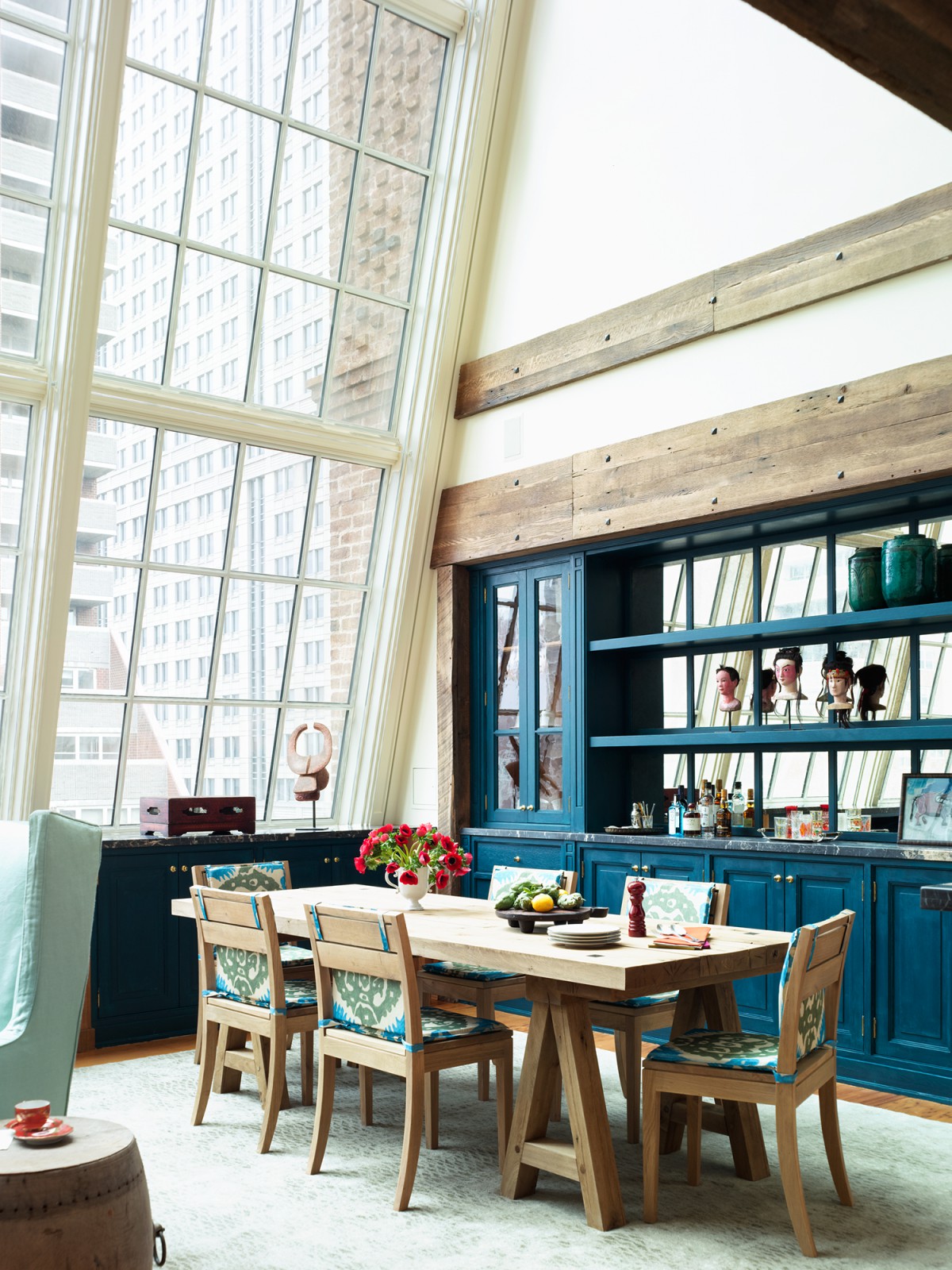 Detail of the large window and dining area in the Greenwich Penthouse