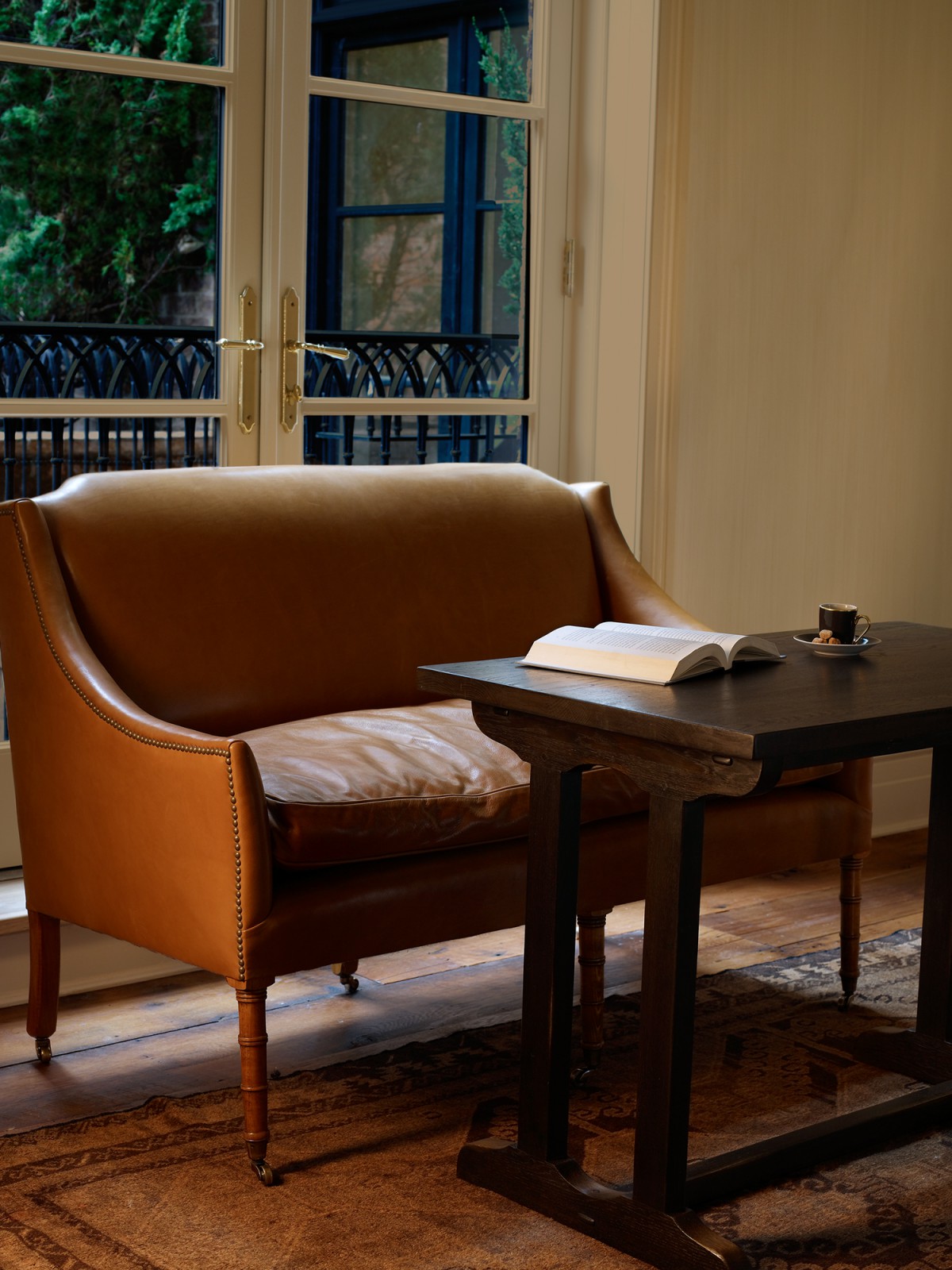 View of settee and doors to the balcony in the Superior King room