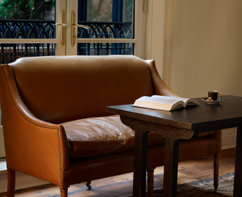 View of settee and doors to the balcony in the Superior King room