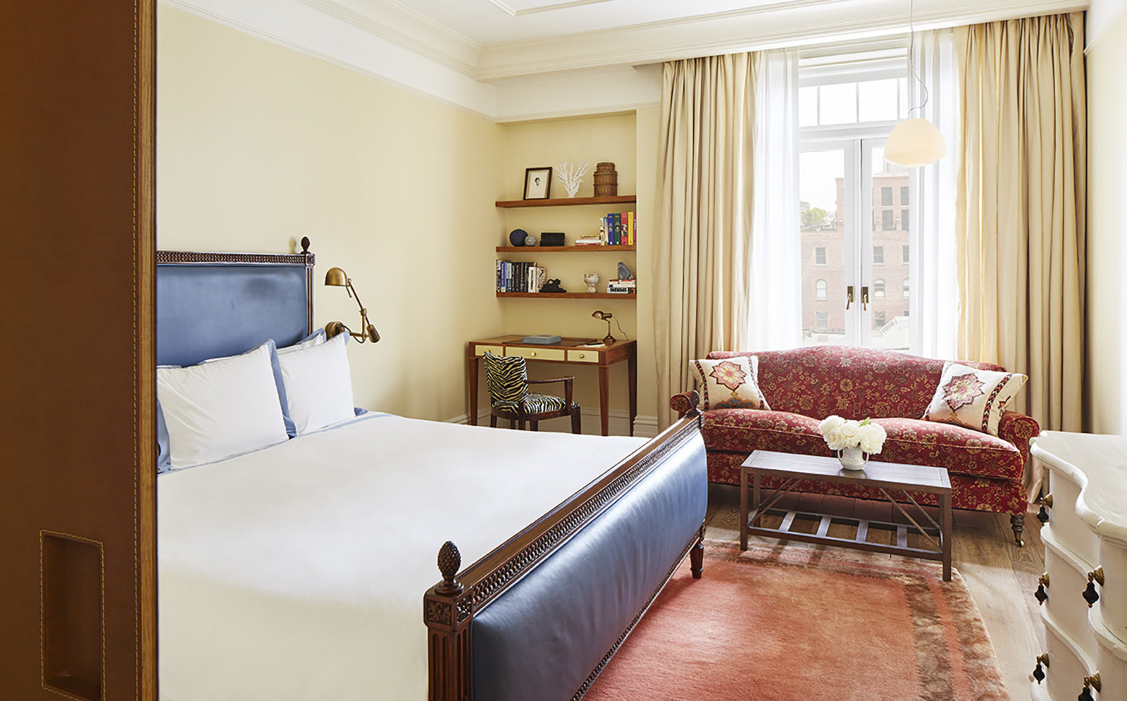 View of the bed, desk and seating in the Superior King with Soaking Tub room