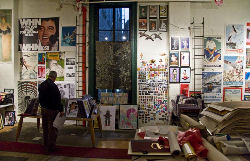 A customer looks through posters at Philip Williams Posters