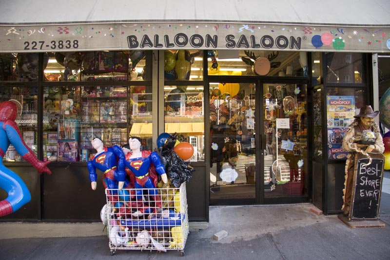 Inflatable super heroes on the street in front of the Balloon Saloon