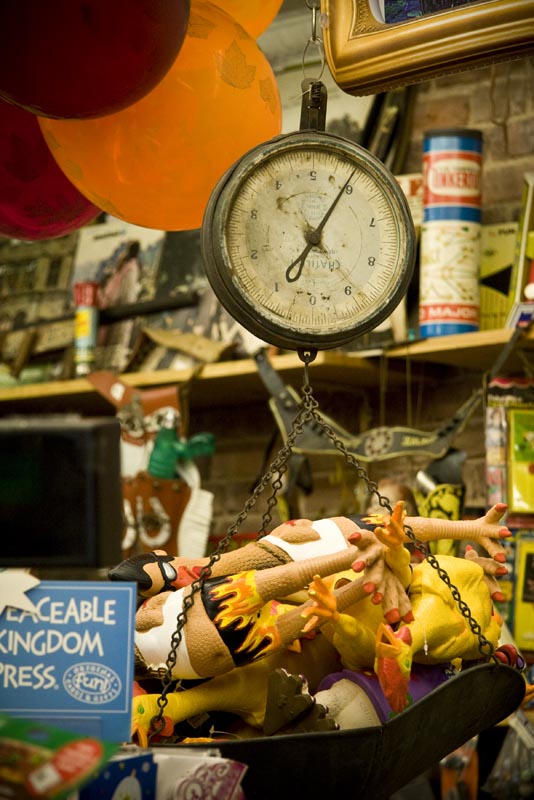 A vintage scale and various objects inside the Balloon Salloon