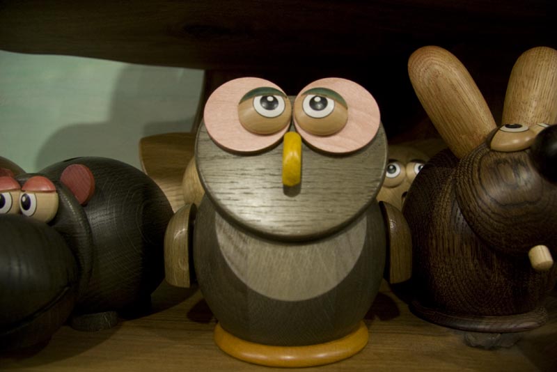 Close up of a wooden owl figure for sale at Playing Mantis Toys and Crafts