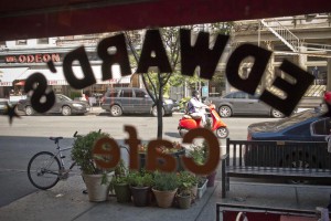 Looking out at the street through the Edward’s logo painted on the windows