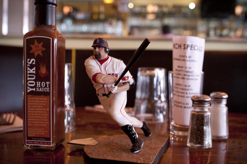 Kevin Youkalis starting lineup figure and hot sauce on the counter top at Edward’s