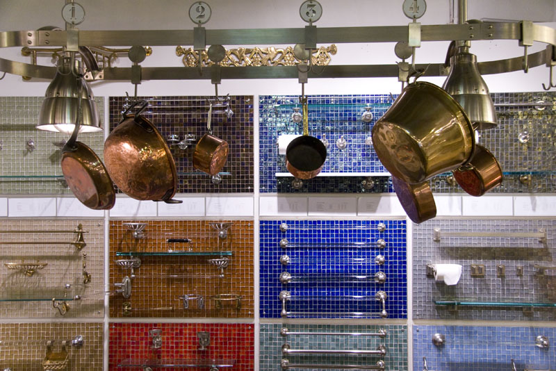 Towel bars and hanging copper pots on display at Urban Archaeology Antiques and Vintage