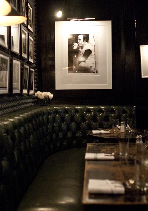 Leather banquette seating and table setting inside Warren 77