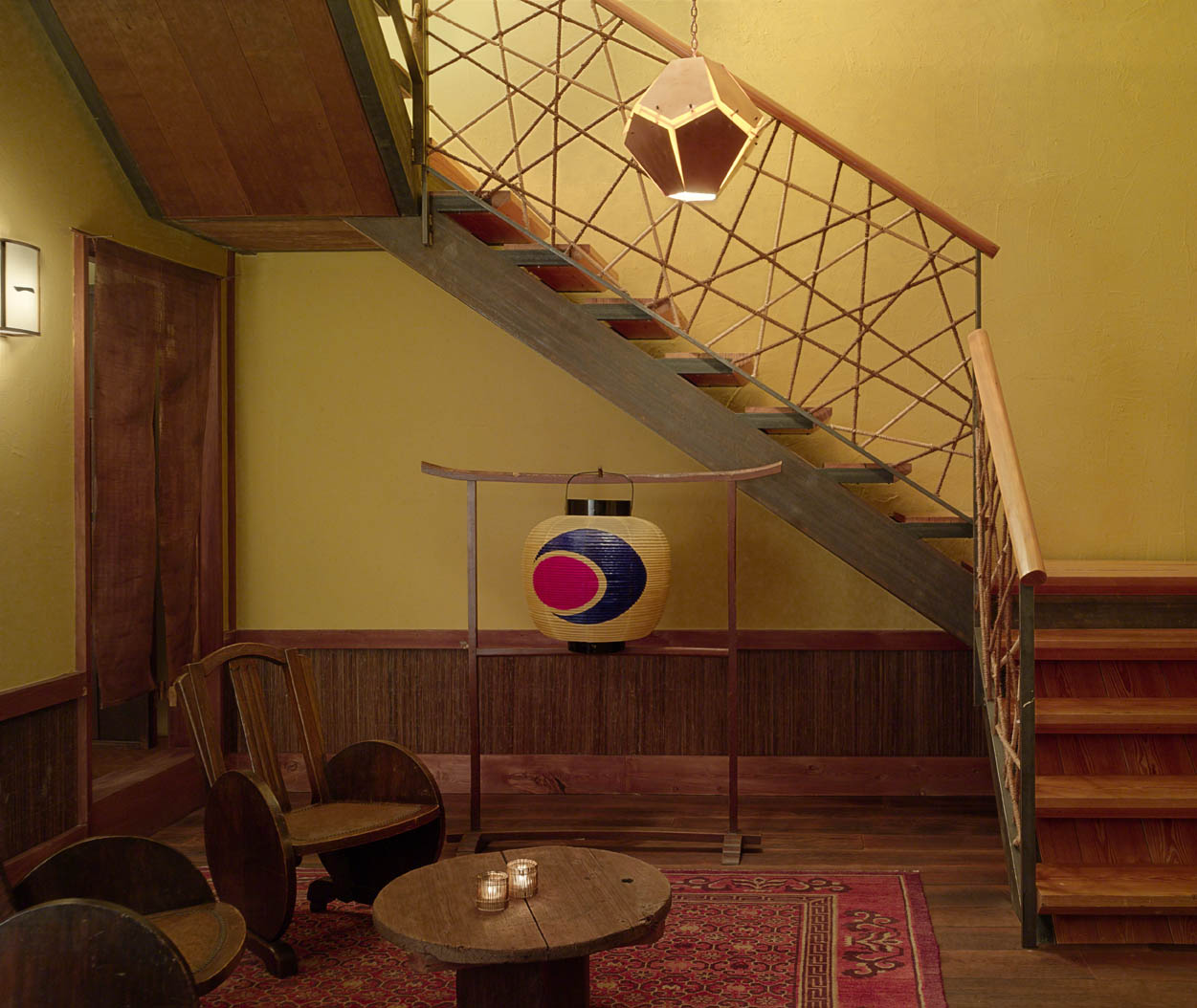 Pendant light hangs in the lounge and stairway at The Shibui Spa at The Greenwich Hotel