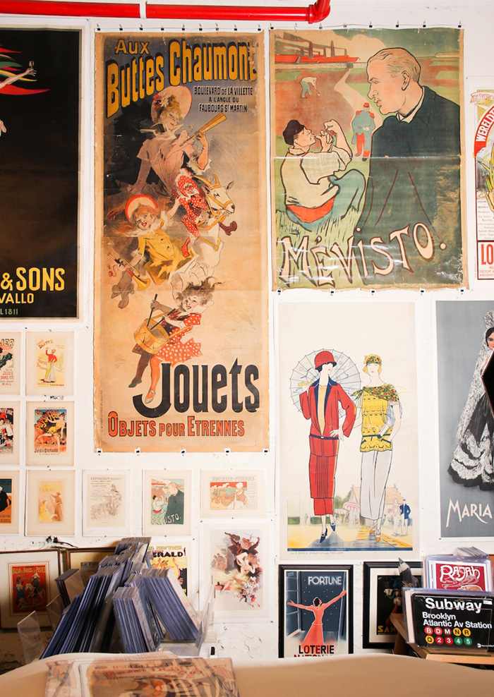 A feature wall of vintage posters inside Philip Williams Posters