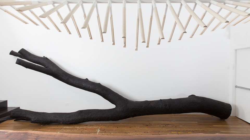 Sculptural wooden objects on display inside the gallery