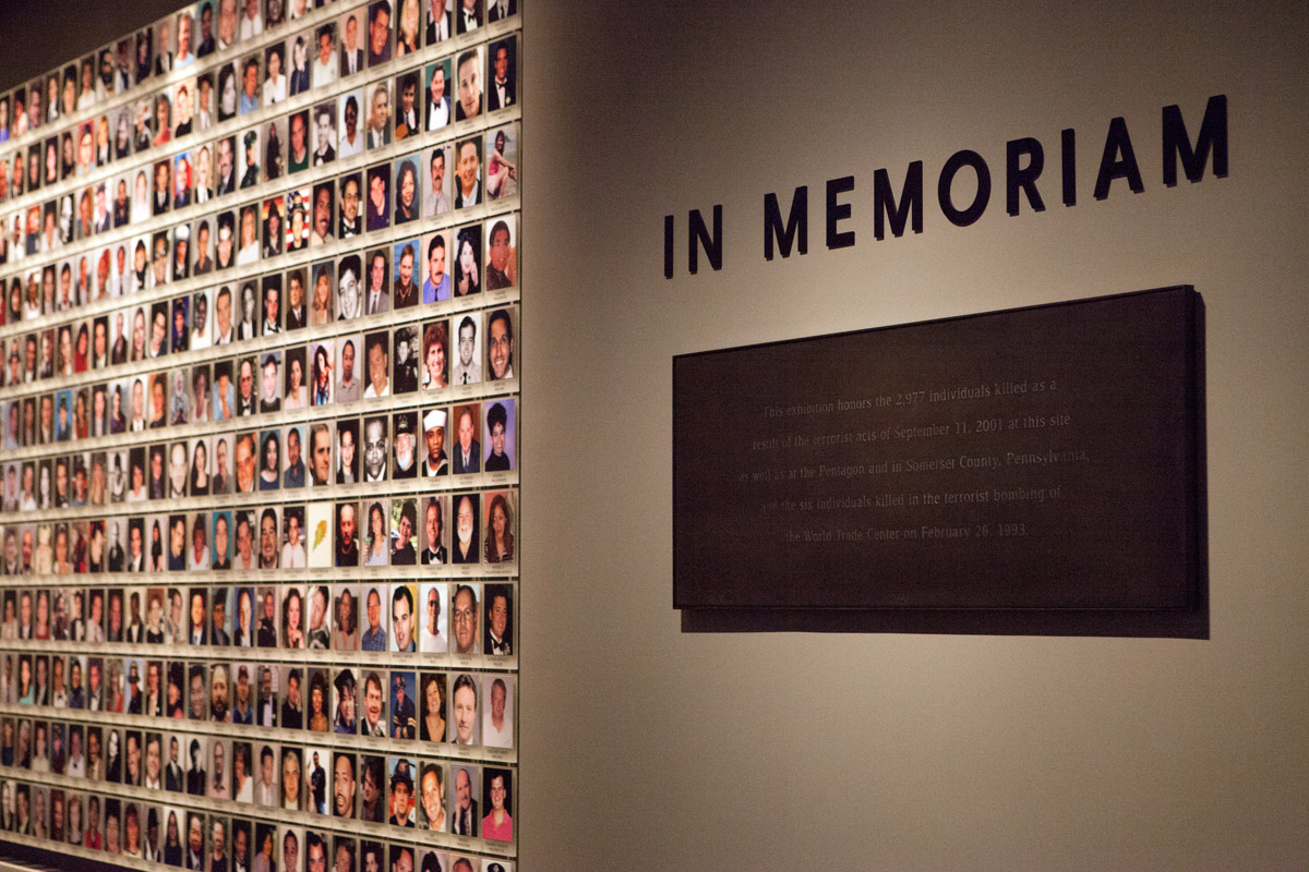 Wall of photos in the In Memoriam feature inside the Museum