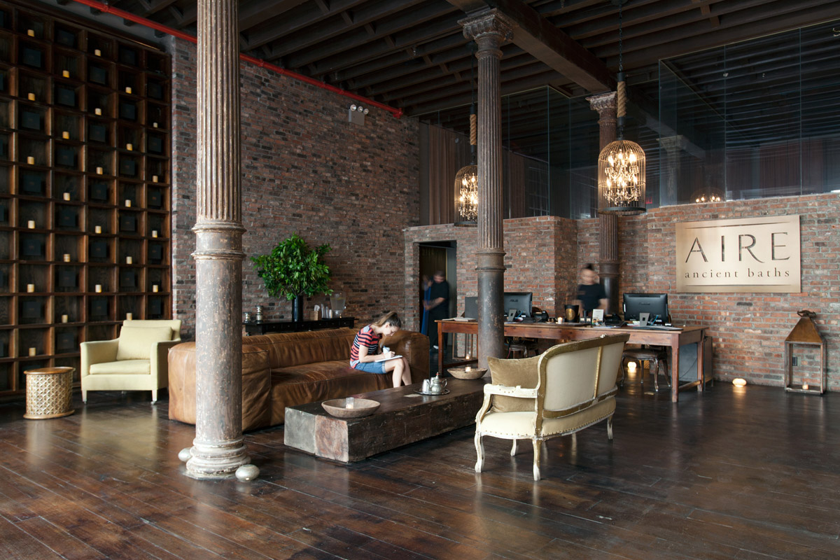 Another view of the lounge and waiting area showing large columns and additional seating