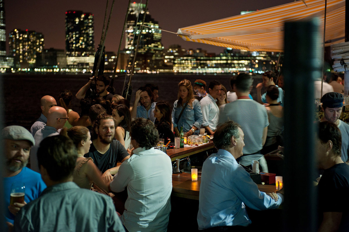 A view of a crowded Grand Banks at night on the water.