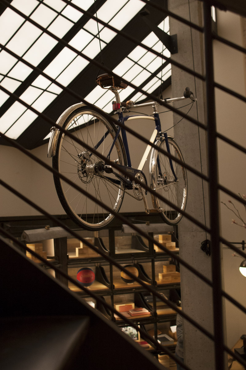 Bike suspended from the ceiling inside of Shinola