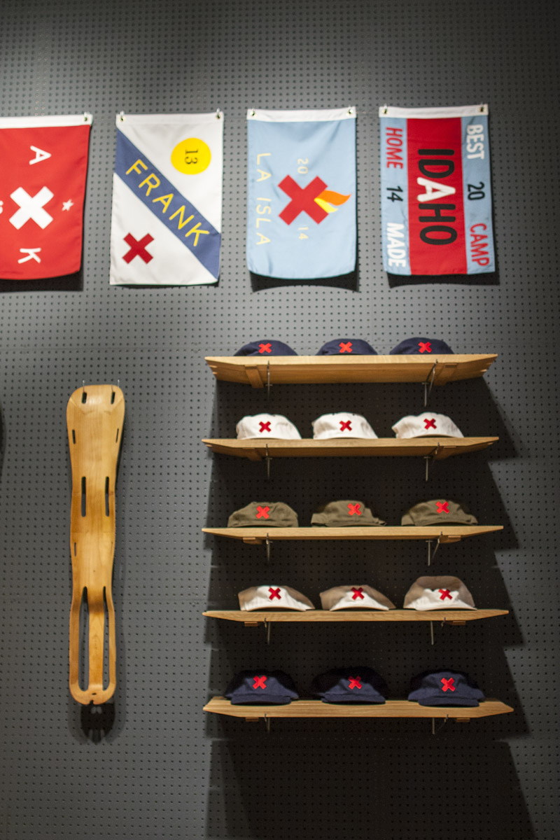 Shop from this custom flag and hat display at Best Made during your stay at The Greenwich Hotel