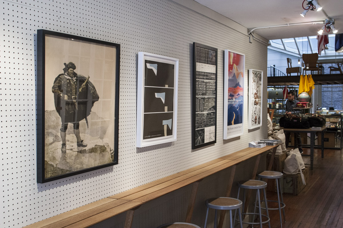 Framed images along the bar rail at Best Made Co. in Tribeca