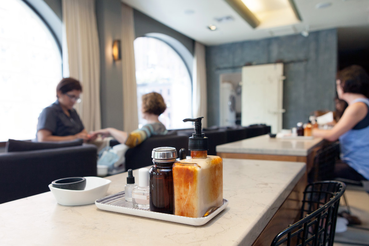 Products on tray on top of a bar seating area inside of Tenoverten