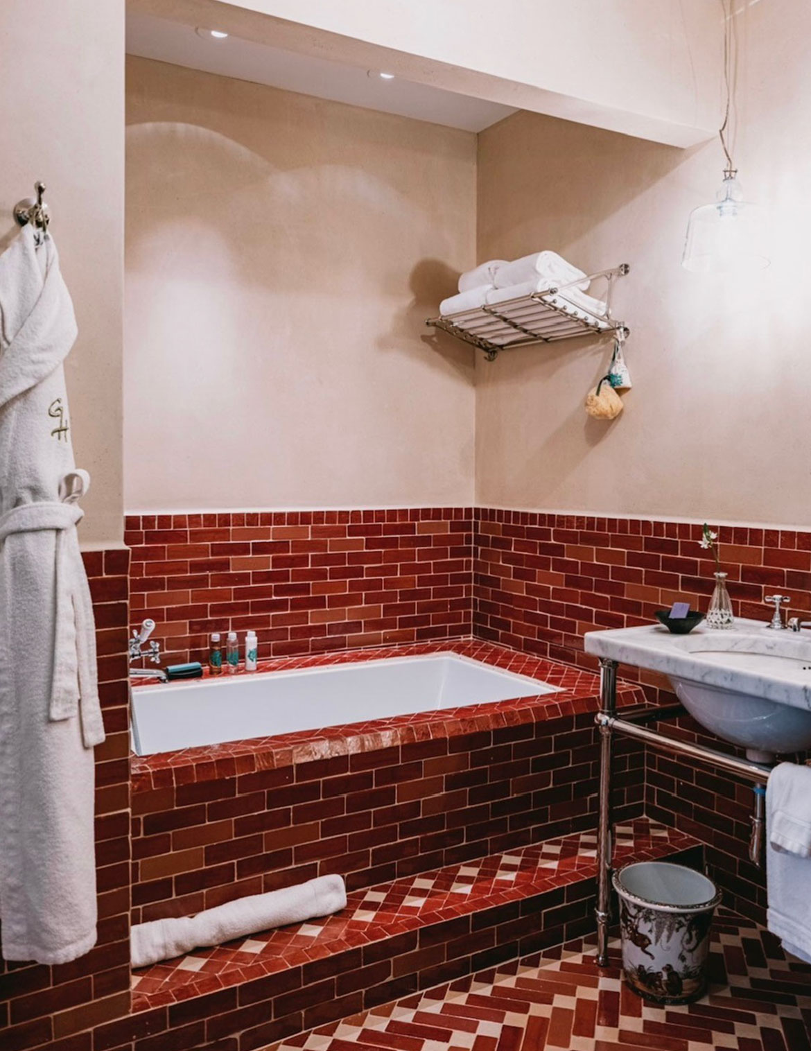 The generously sized bathroom features Moroccan tile, with an extra deep soaking tub alcove, separate walk-in rain shower and double basin sink vanity.
