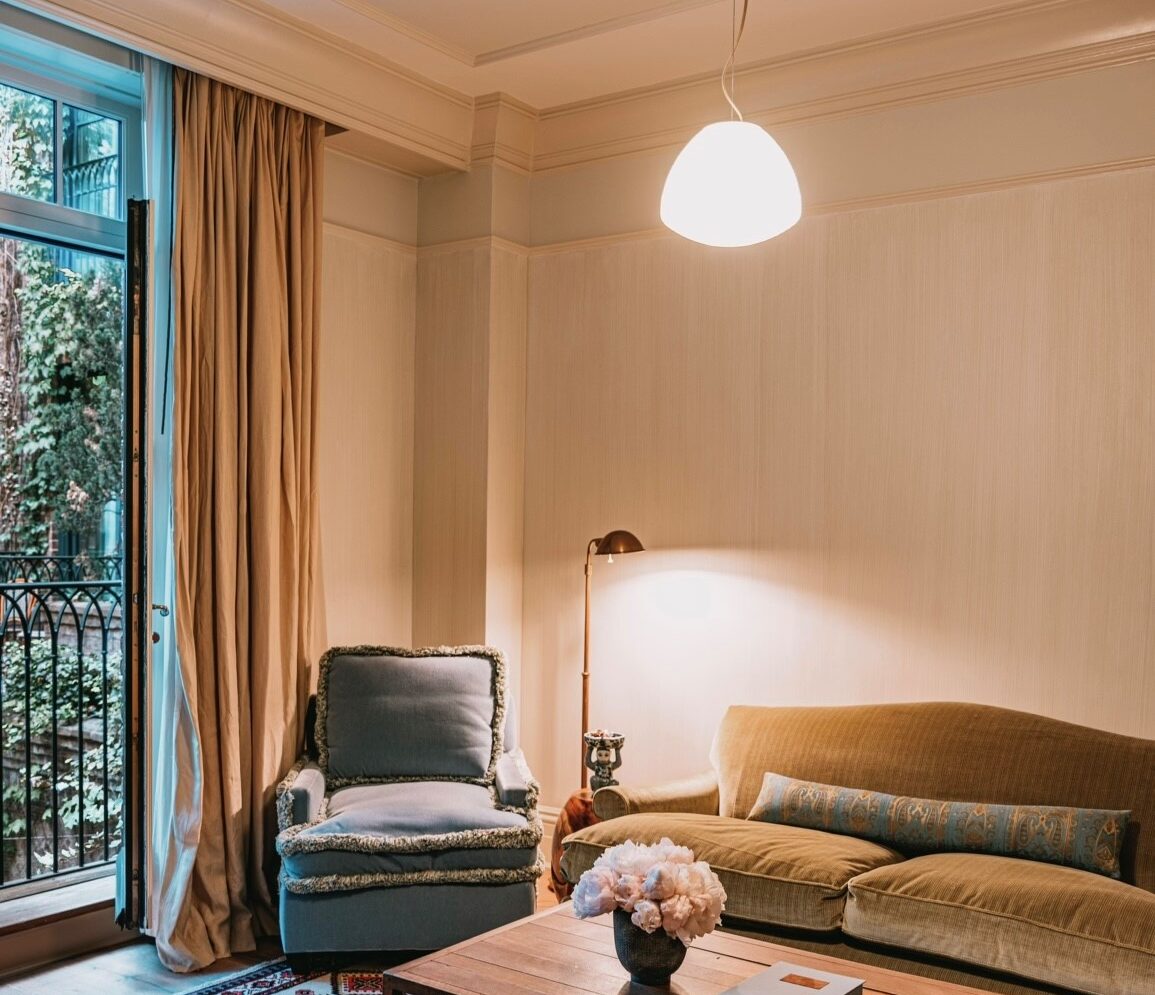 This suite has 10-foot ceilings with intricate molding detail and oak hardwood floors with a separate cozy sitting room.