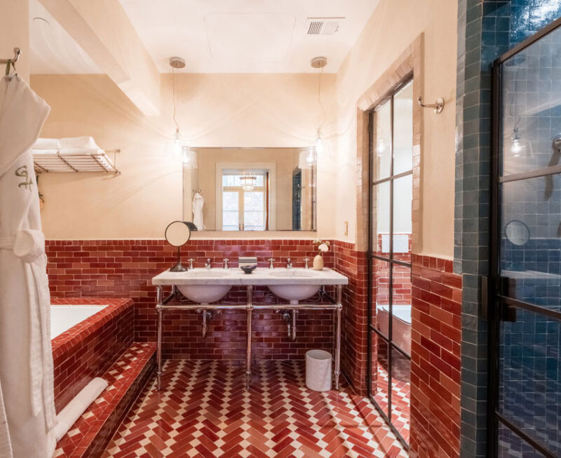 wide view of the bathroom with a double sink