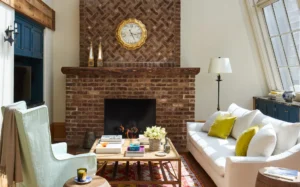 A brick fireplace in the primary living room area inside the first floor of the Greenwich Duplex