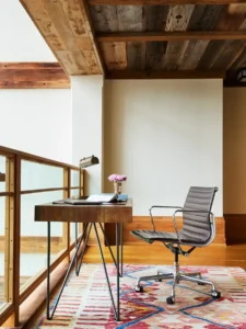 a workspace with desk and chair in the loft balcony