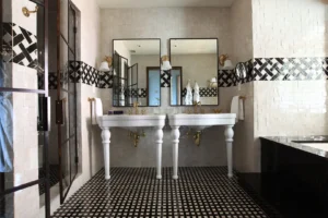 The master bathroom looking directly at the double sink vanities and mirrors
