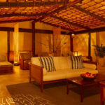 Pool lounge area with couches and beds