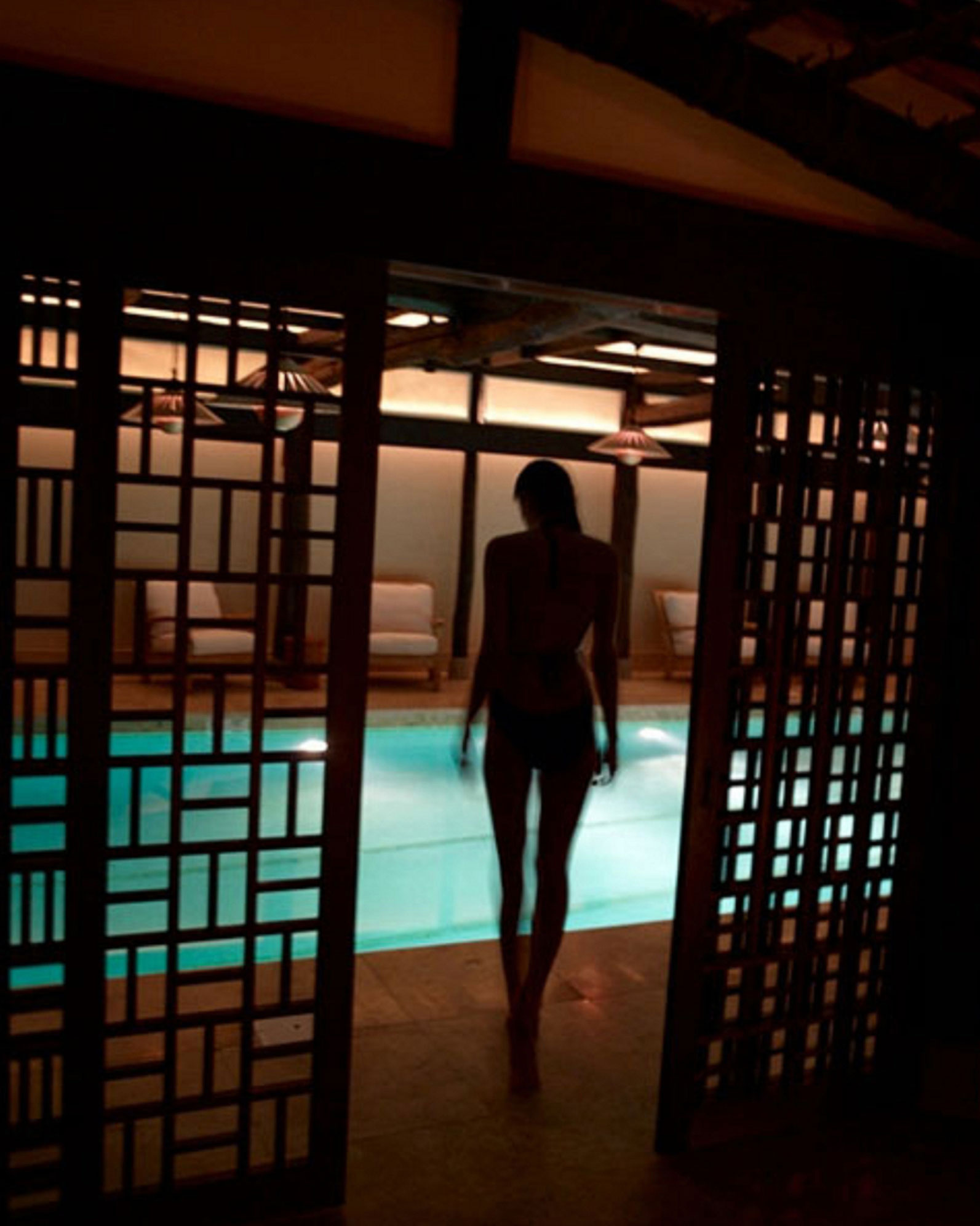 Woman standing in front of pool