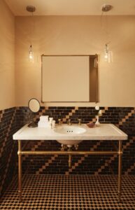 Looking at the mirror, vanity and custom tile work inside the Superior King's bathroom.