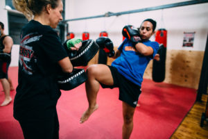 Muy Thai trainer working with a student