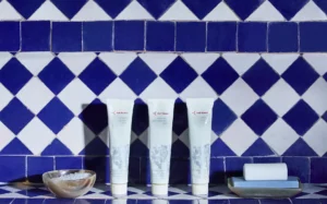 Bath products against a blue and white moroccan tile backdrop