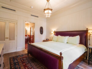 View of the bed and into the bathroom