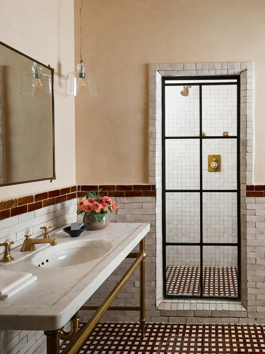 Deluxe King Bathroom with brown and white moroccan tile, a walk-in show and single sink vanity