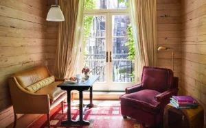 The wood clad ceiling and walls inside a king room at the greenwich hotel
