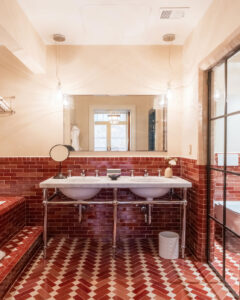 Portrait view of the bathroom with a double sink