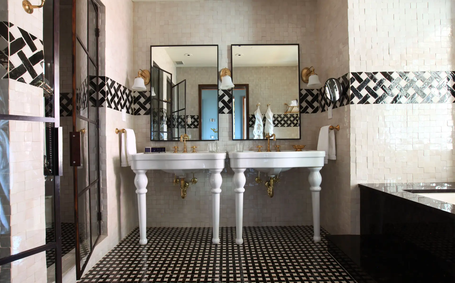 The master bathroom looking directly at the double sink vanities and mirrors