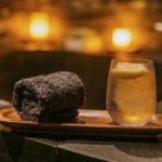 A hot towel and drink during a relaxing bath treatment at the luxury spa, Shibui Spa, in NYC