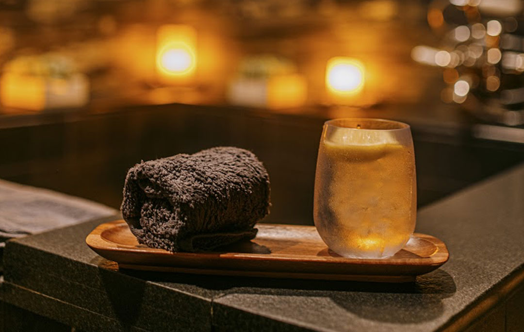 A hot towel and drink during a relaxing bath treatment at the luxury spa, Shibui Spa, in NYC