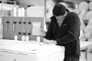 Craftsman building mattresses at Savoir