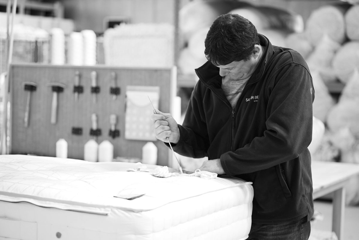 Craftsman building mattresses at Savoir