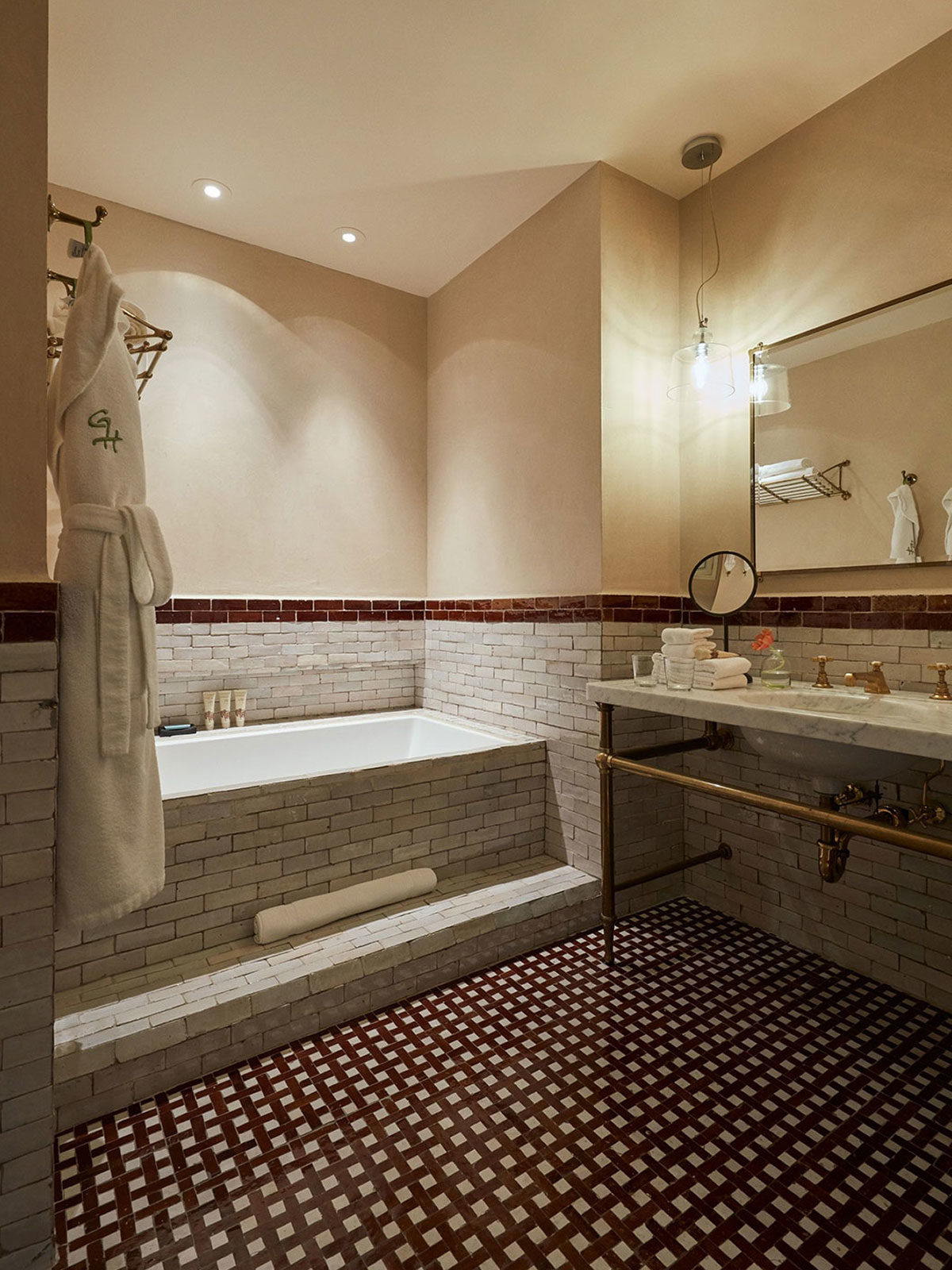 Bathroom with Red and White Tile at The Greenwich Hotel