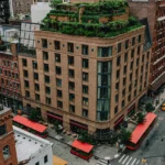 A Drone view of the exterior of the Greenwich Hotel showing a wide shot of the hotel and it's surrounding TriBeCa neighborhood