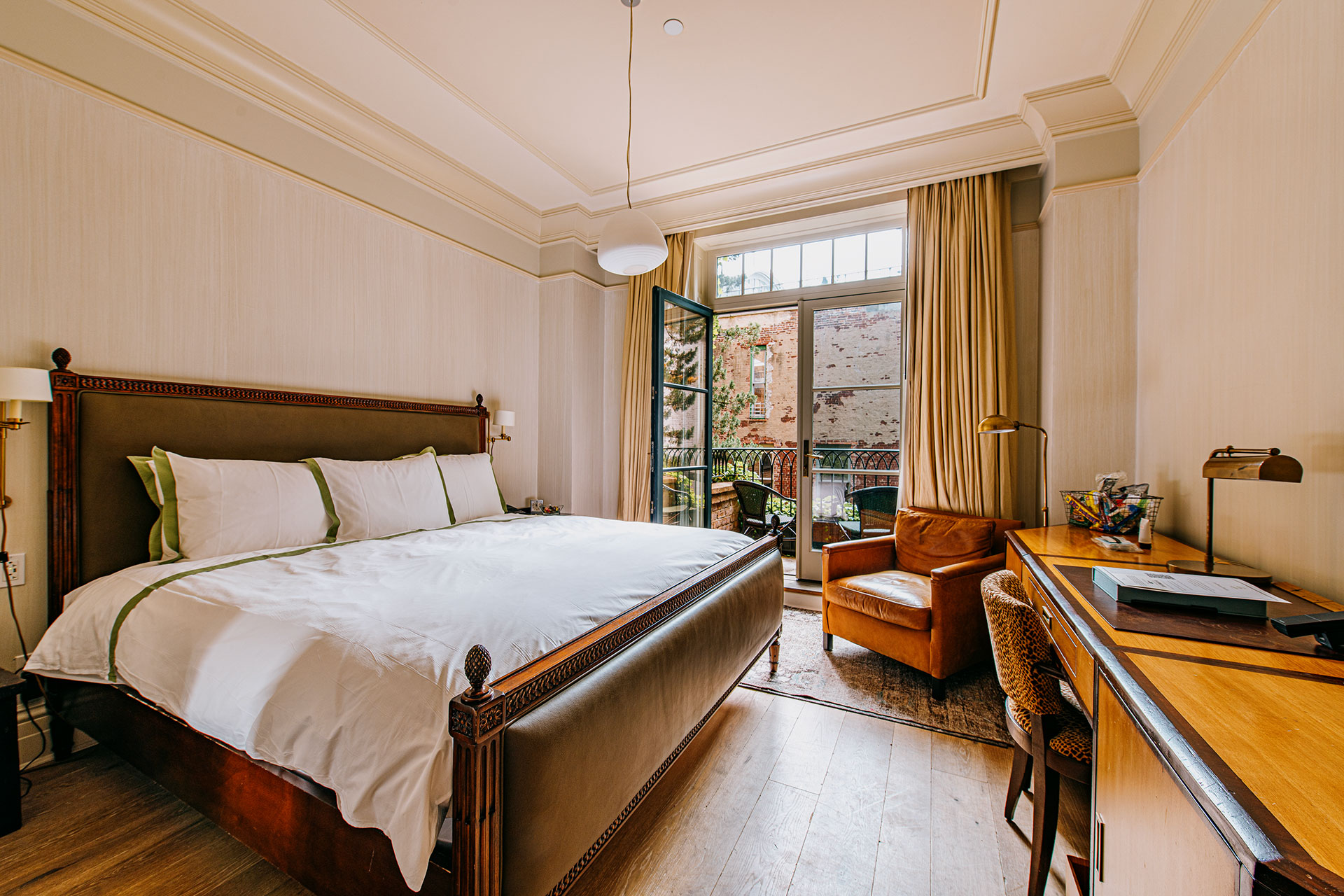 Room view with french doors open to the balcony overlooking Tribeca New York