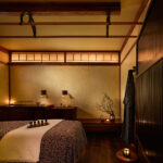 A Shibui Spa treatment room. View of the treatment table/bed, and the earthy decor