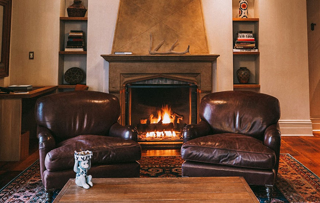 A view of the in-room fireplace and seating area