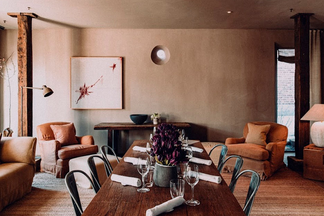 The Dining Table is set while natural light floods the Tribeca Penthouse